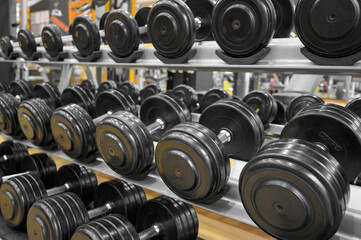 Close up of dumbbells. Gym interior. High quality photo