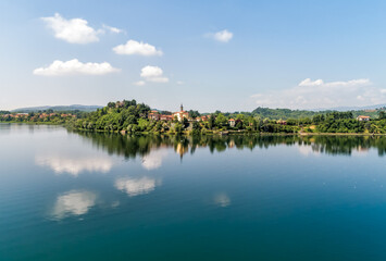 Fototapeta na wymiar Landscape of Lake Varese with view to the church of San Lorenzo of Biandronno, Italy