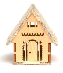 Toy wooden house on a white isolated background as a Christmas and New Year decoration