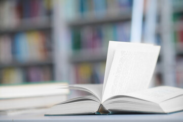 Obraz premium Stacked academic literature arranged on the library desk