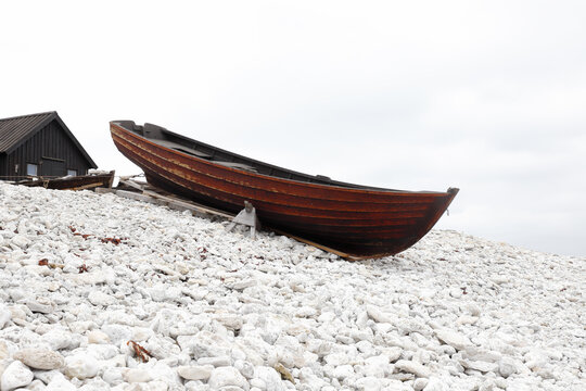 Old wooden open small fishing boat at the Helgumannen fishing station in Swedish province of Gotland.