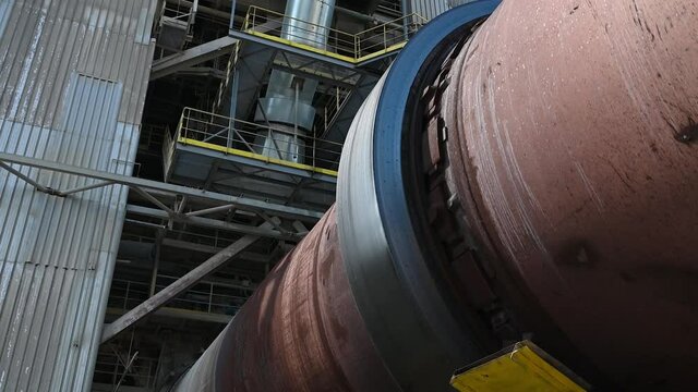 Close up of rotary kiln for clinker production in cement plant 4K.
