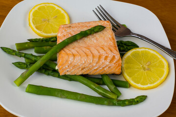 baked salmon  and asparagus  with slice of lemon
