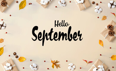 Hello September message with gift boxes with leaves