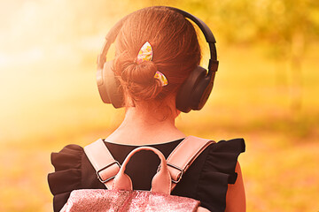 Girl wearing headphones. Stereo sound. Headphones with wireless technology.