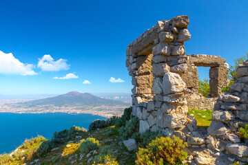 Ruins on the background of Vesuvius and the city of Naples. Italy, Campania