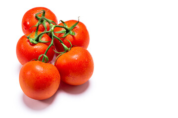 Photo of five wet red natural tomatoes on a white background.The photo has copy space and is shot in horizontal format.