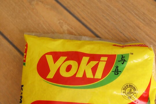 Bahia, Brazil - August 19, 2025: Yoki logo on wooden background. Yoki is a Brazilian brand of food products.