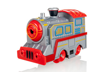 Wind-up toy steam locomotive on batteries, steam locomotive, railway, isolated on a white background, close-up