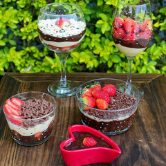 a table filled with a delicious strawberry and chocolate dessert