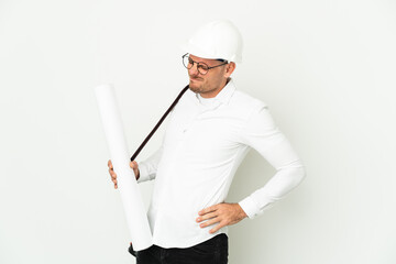 Young architect man with helmet and holding blueprints isolated on white background suffering from backache for having made an effort