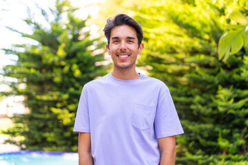 Young caucasian man at outdoors With happy expression