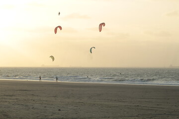 Some colorful ketesurf sails in the air, on a beach on the island of São Luís MA, northeast of Brazil