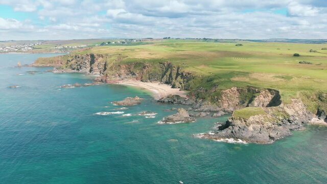 Aerial drone shot of beautiful coast and sandy cove in South Devon, UK