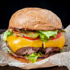 Fresh hamburger with herbs and cheese