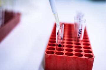 FACS tube in red rack and blue liquid