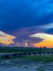 Swamp sunset and hurricane clouds