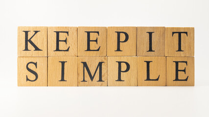 The word keep it simple was created from wooden cubes. education concept.