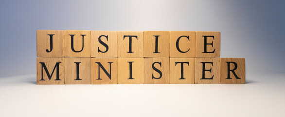 The word justice minister was created from wooden cubes. State and law.