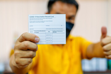 Covid-19 vaccination record card concept about standard health care.
