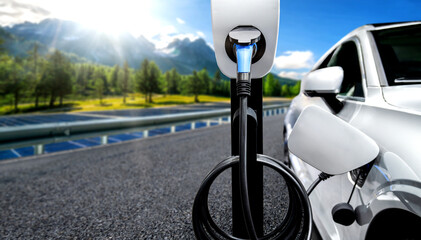 EV charging station for electric car in concept of green energy and eco travel . The electric power...