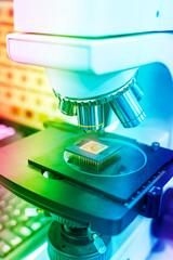 microscope and the microchip.Hi-precision micro processor manufacturing concept.