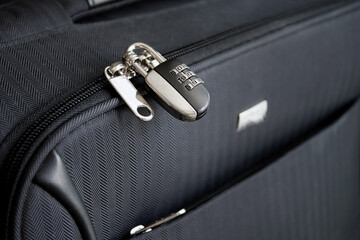 Closed combination lock on suitcase. Closeup of padlock locked on case, Safe travel concept.