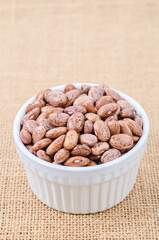 Raw Organic cranberry beans in withe bowl