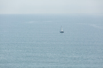 white yacht sailing in spring ocean of shichirigahama, kamakura