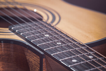 Fototapeta premium Close-up of a classical acoustic guitar in beautiful lighting.