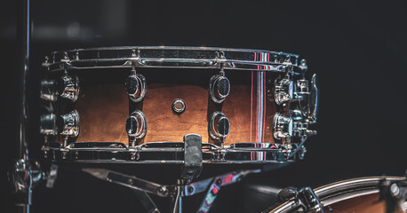 Close-up of a snare drum, part of a drum kit.
