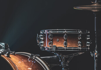 Part of a drum kit, drums on a dark background, copy space.
