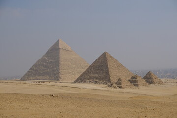 Fototapeta na wymiar Egypt Cairo - The three main pyramids at Giza and subsidiary pyramids