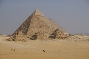 Fototapeta na wymiar Egypt Cairo - The three main pyramids at Giza together with subsidiary pyramids