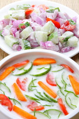 Indian raitha , cucumber, onion, tomato salad with curd cream.