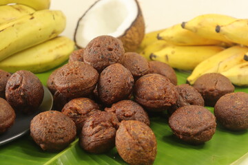 Rice fritters made with a batter of rice flour, banana, jaggery and roasted coconut pieces. Made in...