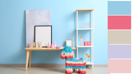Interior of modern room with pinata, table and shelf. Different color patterns