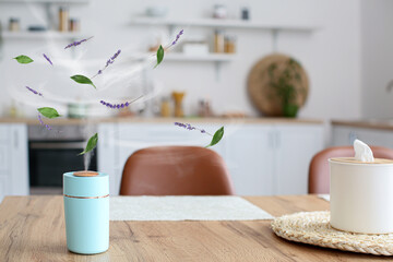 Modern humidifier on table in kitchen