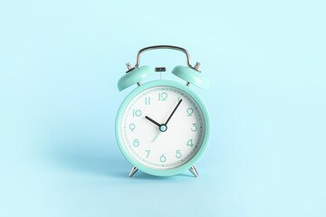 Fototapeta na wymiar Stylish alarm clock on color background