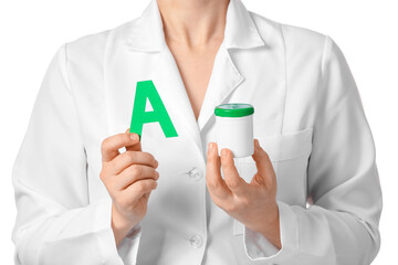 Female doctor holding medical bottle and letter A on white background