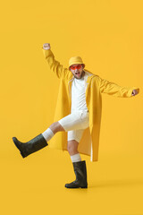 Handsome young man on color background