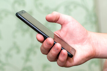 smartphone in the hand of a person close-up