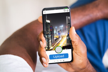 Man Checking Blood Sugar Level On Smart Phone