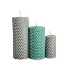 Different wax candles on white background