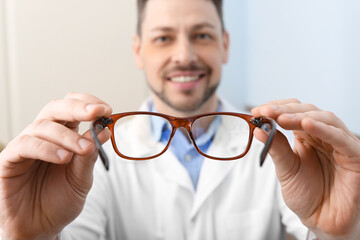Male ophthalmologist with eyeglasses in clinic