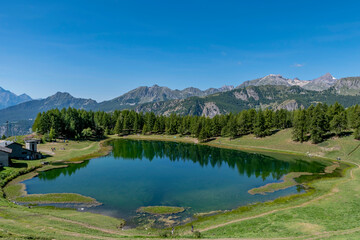 Panoramic view of the Lake of Lod, Chamois, Valtournenche, Aosta valley, Italy, in the summer season