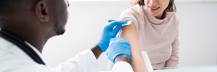 Doctor Injecting Patient With Coronavirus Vaccine