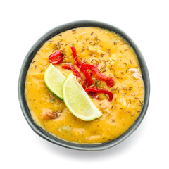 Bowl of tasty chicken curry on white background