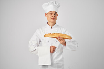 chef holding a loaf of fresh product in hand Professional Baker