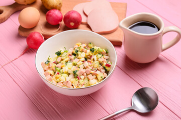 Bowl with different ingredients for okroshka on color wooden background